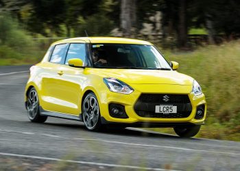 Suzuki Swift Sport front three quarter view driving around corner