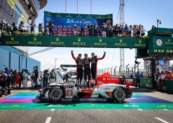 Toyota Gazoo Racing GR010 Hybrid on podium with Brendon Hartley