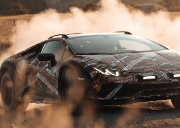 Lamborghini Huracan Sterrato all-terrain supercar drifting off road front three quarters