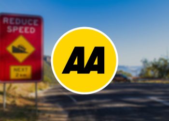 AA logo in front of reduce speed road sign