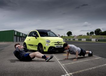 Abarth front three quarter view with people working out in front