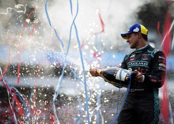 Mitch Evans spraying champagne on Formula E podium