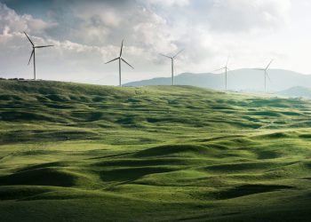 Wind farm along green hills