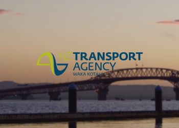 Waka Kotahi logo with Auckland Harbour Bridge at sunset in background