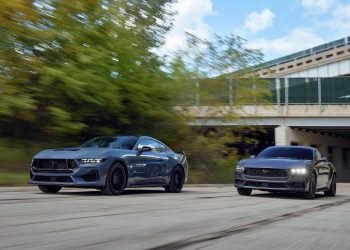 Ford Mustangs racing on road