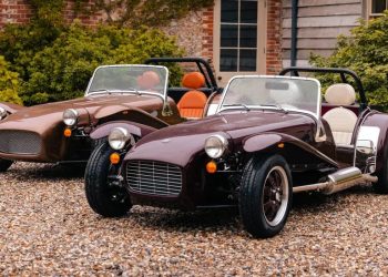 Two Caterham Super Sevens parked next to each other front three quarter view