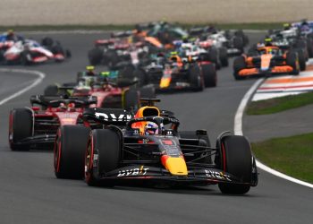 Formula 1 cars racing with Max Verstappen Red Bull leading