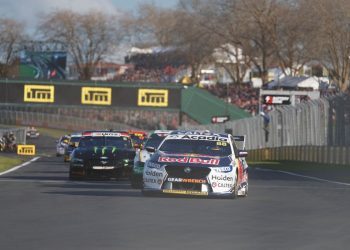 Holden Commodore Supercar leading race pack at Pukekohe Park Raceway front view