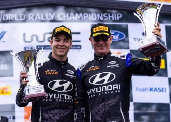 Hayden Paddon and John Kennard holding up trophies