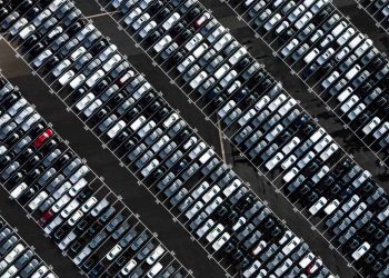 New cars waiting in line bird's eye view