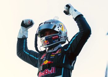 Shane van Gisbergen celebrating with arms in air