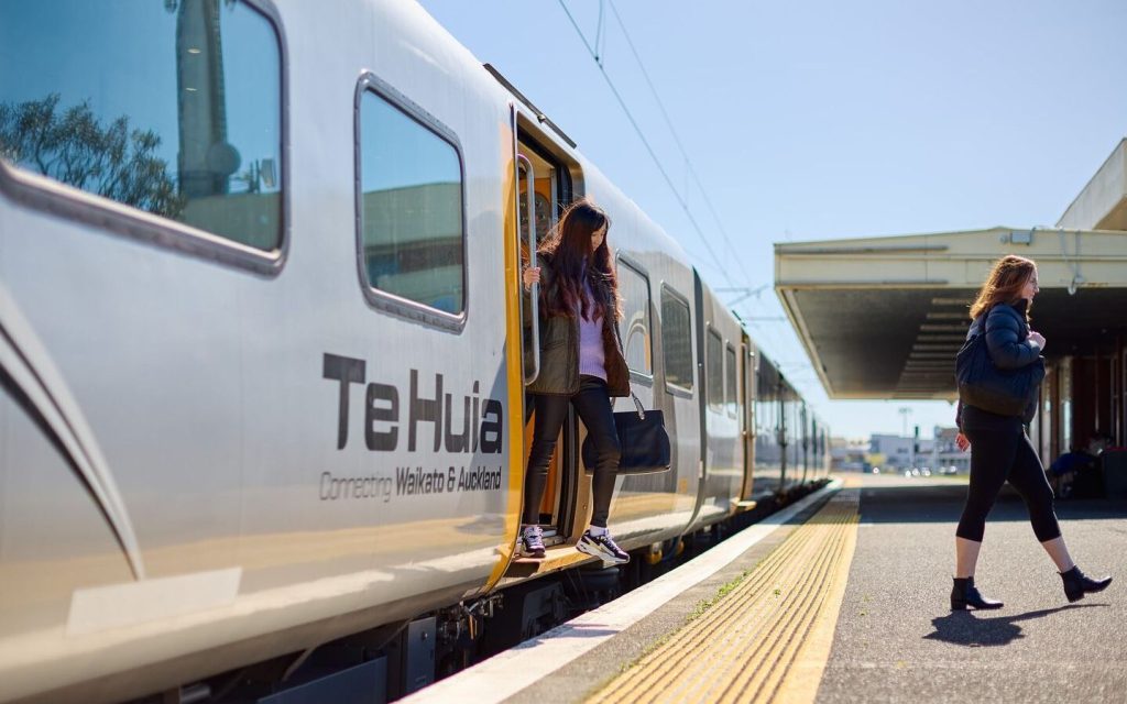 Person getting off Te Huia train carriage