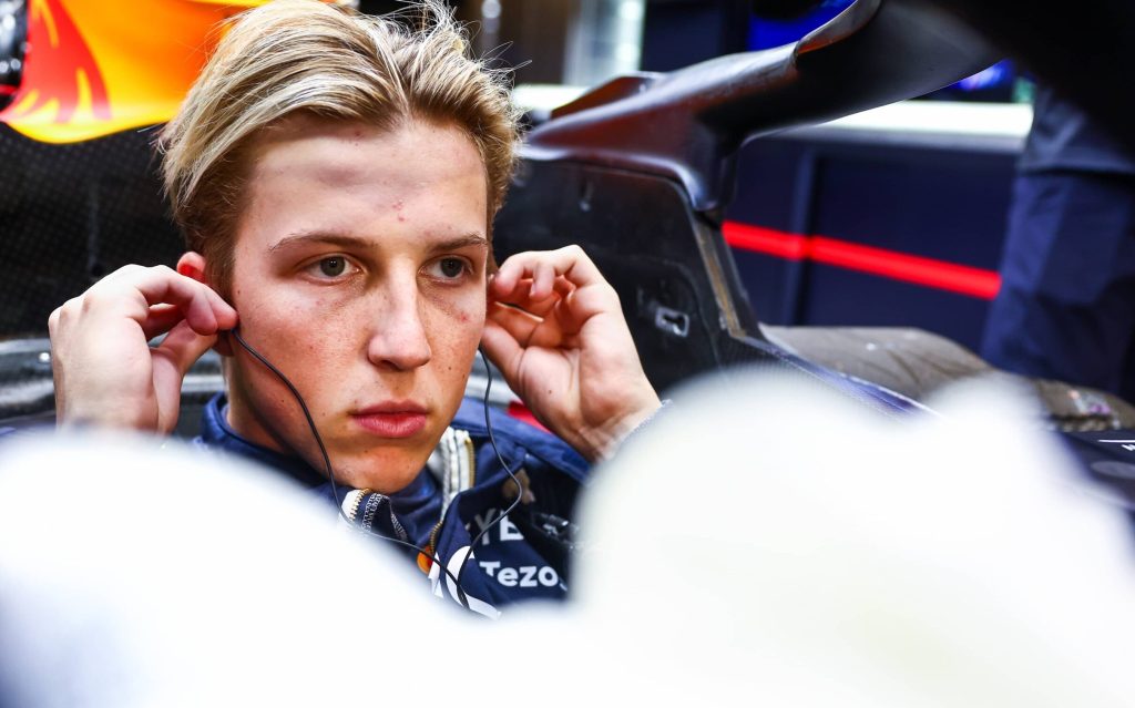 Liam Lawson sitting in Red Bull F1 car