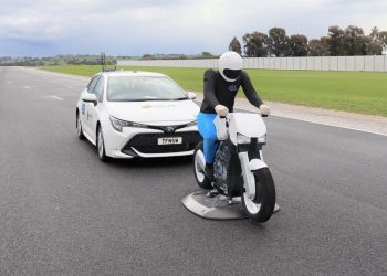 Toyota Corolla behind bike safety dummy