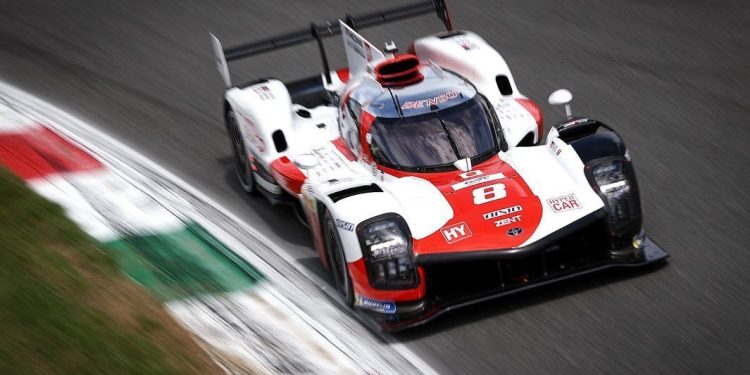 Brendon Hartley's Toyota GR010 front three quarter view racing on track