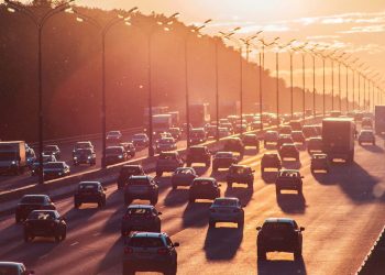 traffic on motorway at sunset