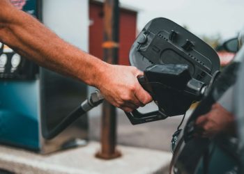 Person filling car up with fuel