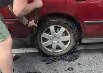 Tar seal stuck to car tyre