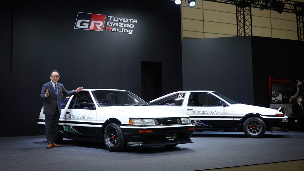 Akio Toyoda standing next to Toyota Corolla Levin and Trueno