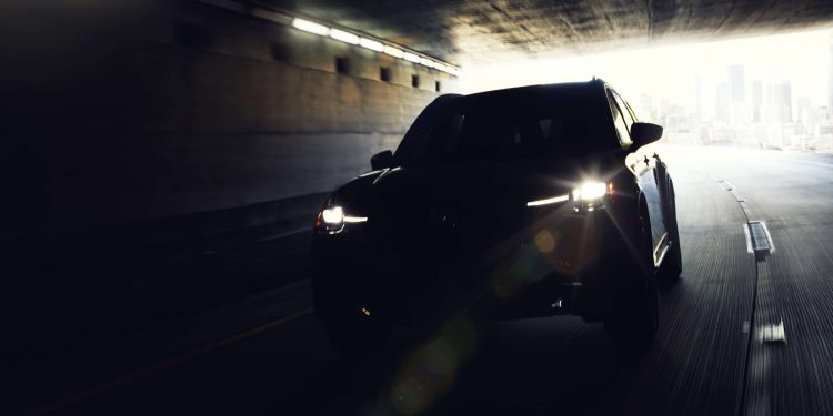 Mazda CX-90 driving through tunnel