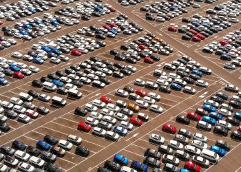 Rows of new cars in car park