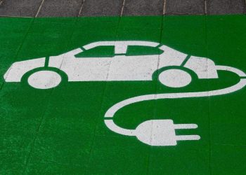 Electric vehicle charging icon on ground