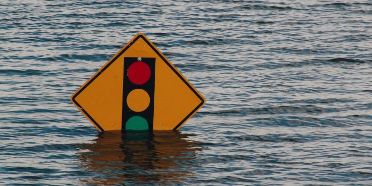 Traffic light sign in flood