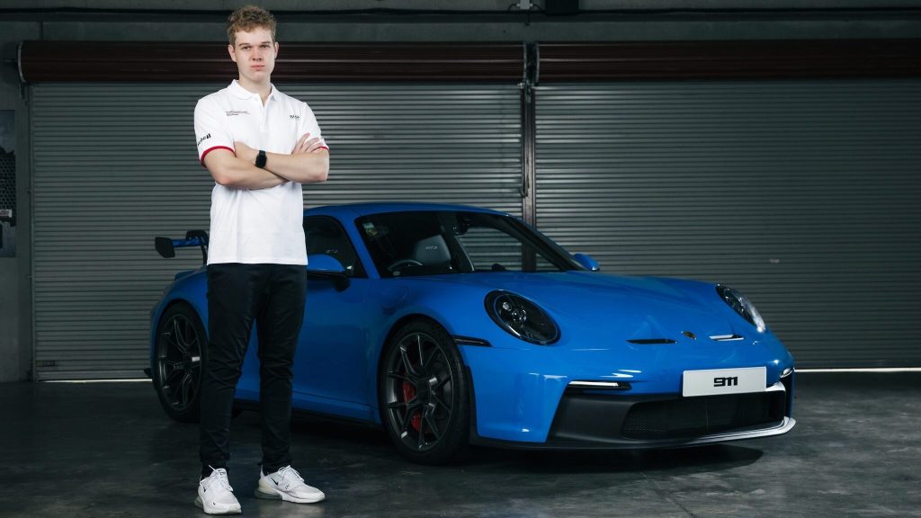 Marco Giltrap standing next to Porsche GT3