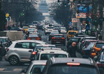 Man standing in traffic