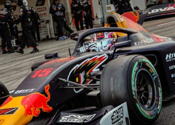 Liam Lawson driving Super Formula car in pit lane