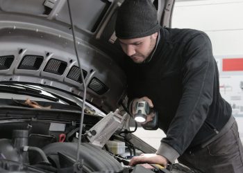 Mechanic working on car