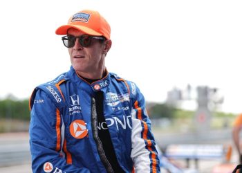 Scott Dixon sitting on pit wall