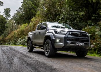 Toyota Hilux driving on gravel road