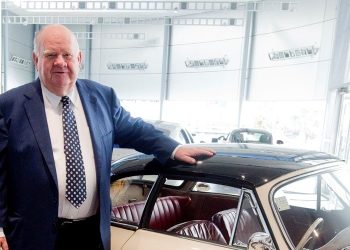 Colin Giltrap standing next to car