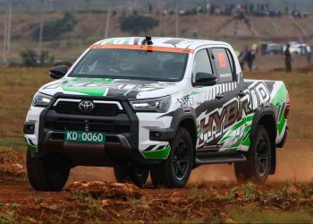 Toyota Hilux hybrid driving on dirt road in Africa