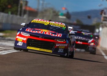 Shane van Gisbergen driving Supercar up pit lane in Townsville