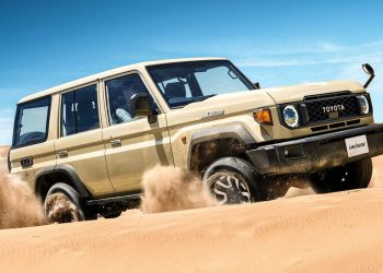 Facelift Toyota Land Cruiser 70 Series driving through sand