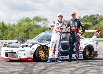 Mad Mike and Max Verstappen standing next to Mazda RX-7 drift car