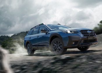 Subaru Outback XT Special Edition driving up gravel road