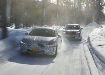 2024 Skoda Superb and Kodiaq driving on snowy road in forest