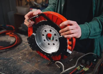 Alexander Burton holding REVR electric motor