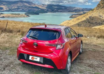 Toyota Corolla Ezi rental car parked by lake look out