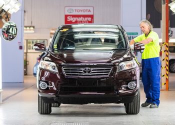 Used Toyota being inspected by technician