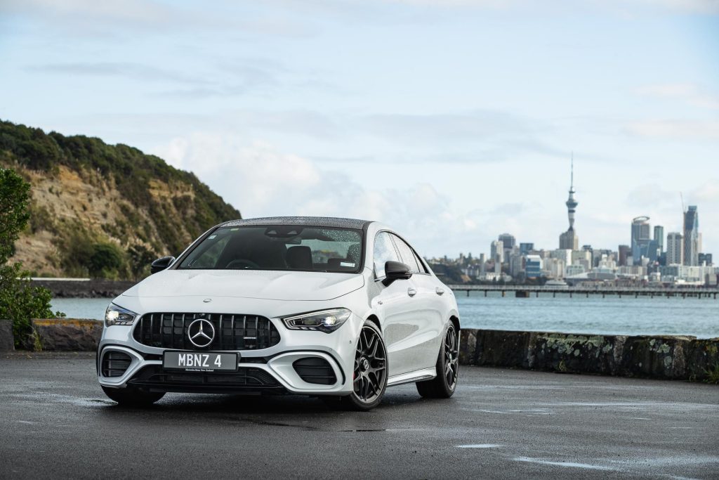Mercedes-AMG CLA 45 S 4MATIC parked in front of the Auckland city skyline