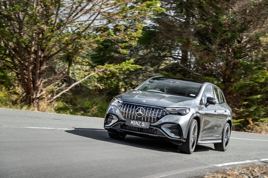 Front quarter shot of the 2024 Mercedes-Benz EQE 53 cornering at speed