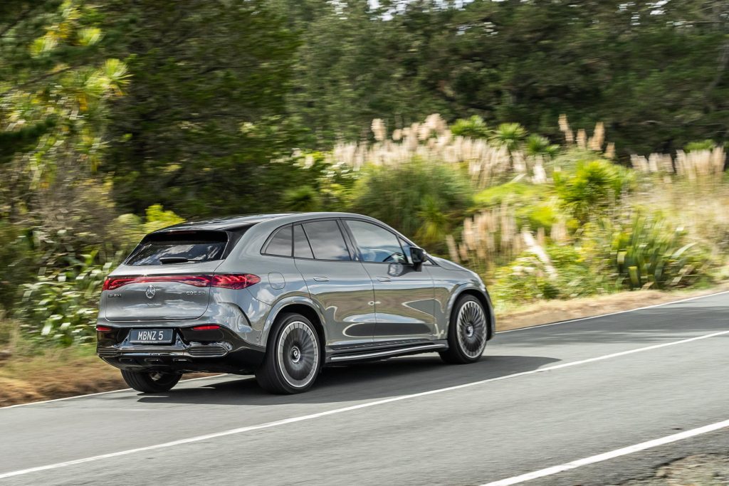 Rear panning shot of the 2024 Mercedes-Benz EQE 53, exiting a corner