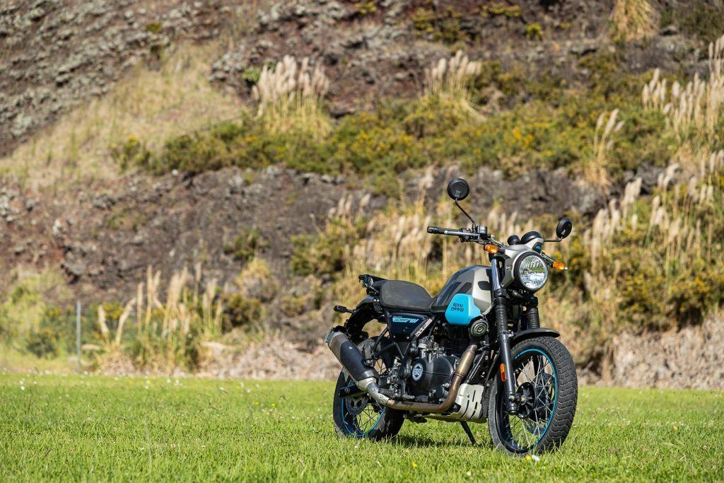 Royal Enfield Scram 411 front quarter shot, off roading in a paddock