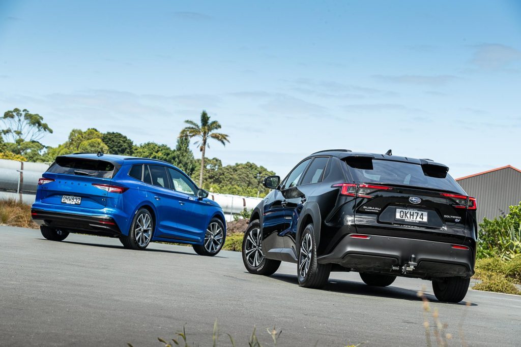 Skoda Enyaq Sportline 80 vs Subaru Solterra parked showing the rear of both cars