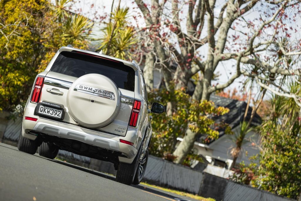 2024 GWM Tank 500 Ultra taking a corner, shown from the rear