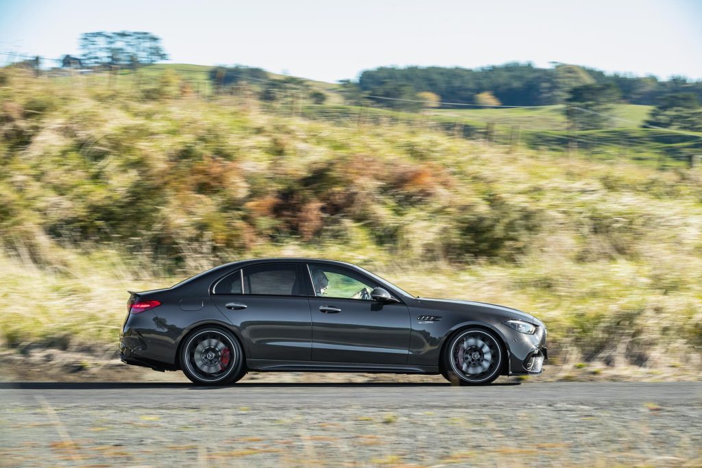 Side profile panning shot of the 2024 Mercedes-AMG C 63 S